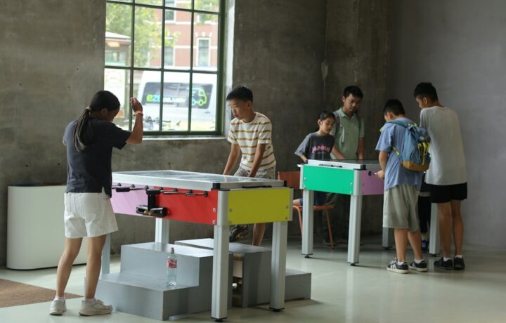 Illustrative stock photo of people taking part in indoor community activities; not the Sela centre in Netanya. Photo: Yanhao Fang / Unsplash.
