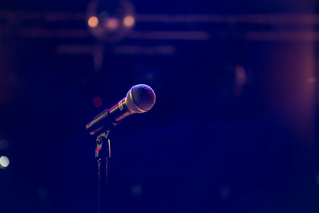 Illustrative image of a microphone on a stage; not a photograph of the Netanya event