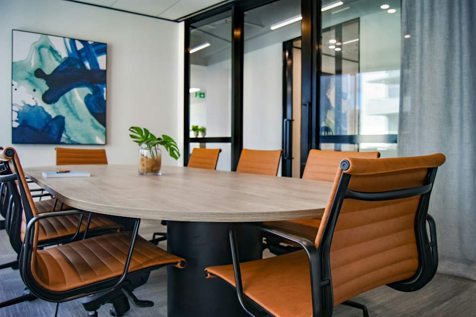Illustrative meeting table, not a photograph of Netanya city council