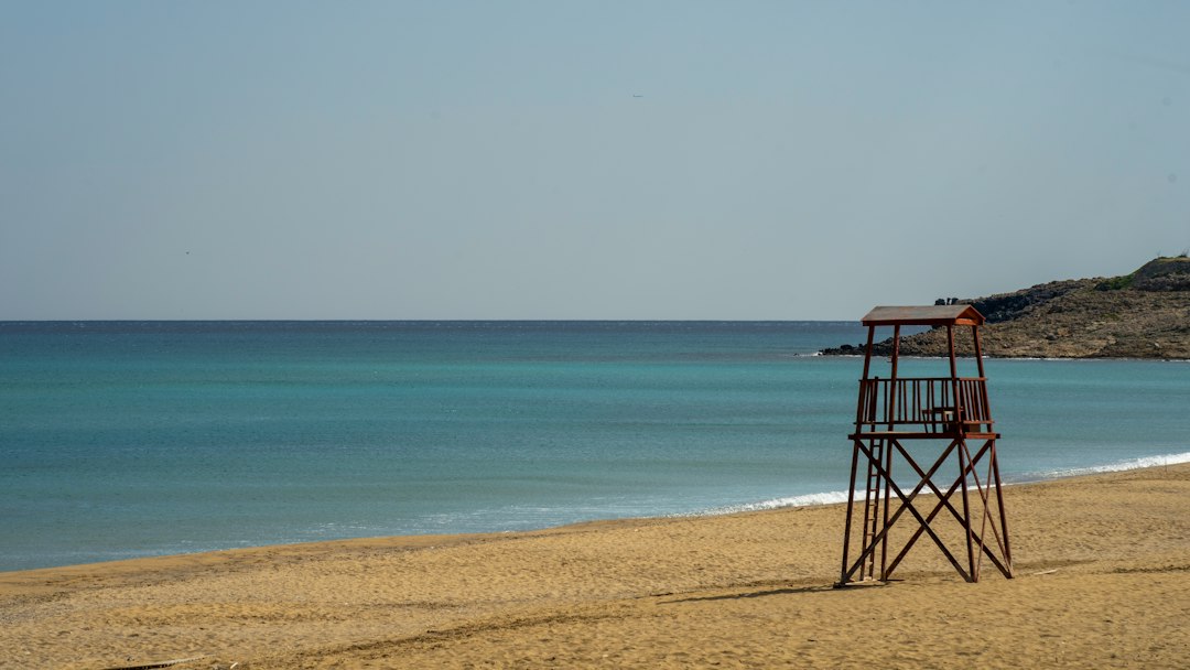 Lifeguard tower on a sandy beach — illustrative stock photo, not a Netanya beach; Jeffrey Zhang / Unsplash