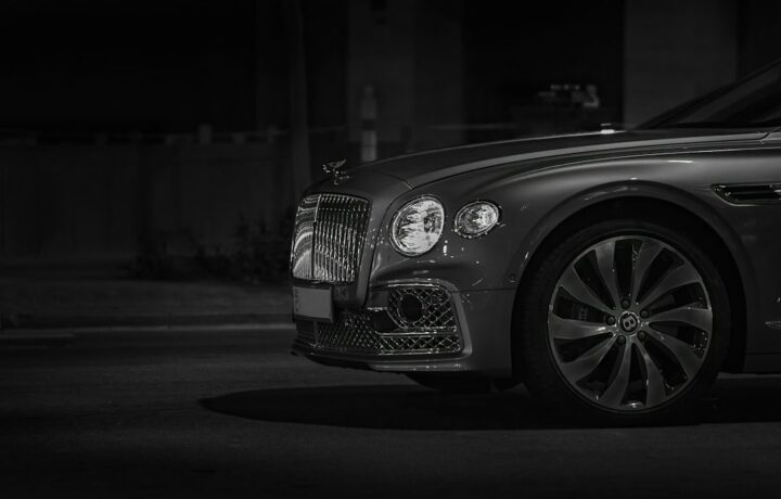 Illustrative stock photo of a luxury car at night; not the vehicle from the Herzliya case. Photo: Victor Furtuna / Unsplash.