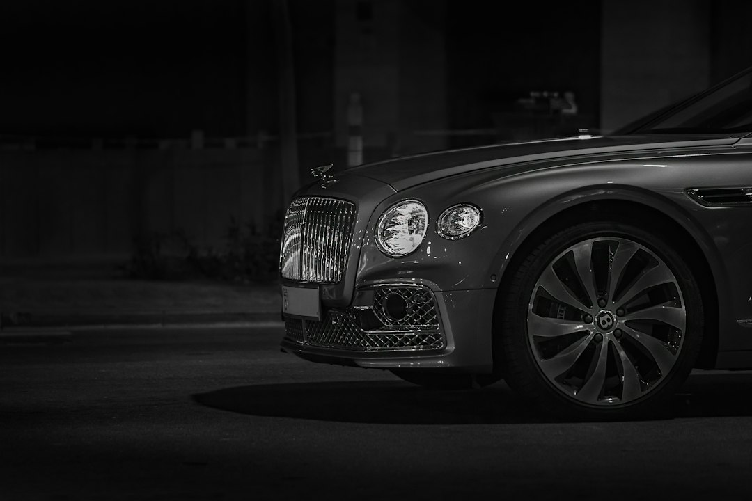 Illustrative stock photo of a luxury car at night; not the vehicle from the Herzliya case. Photo: Victor Furtuna / Unsplash.