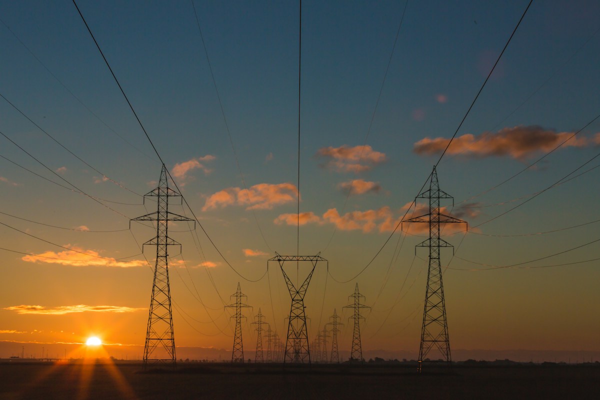 Illustrative electricity pylons; not a photograph of the announced outage location