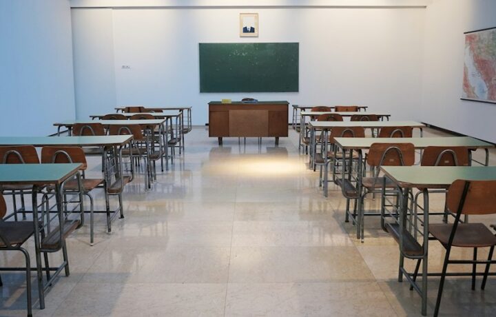 Illustration: a school classroom. Stock photograph by Ivan Aleksic / Unsplash, not a photograph of the school described in the article.