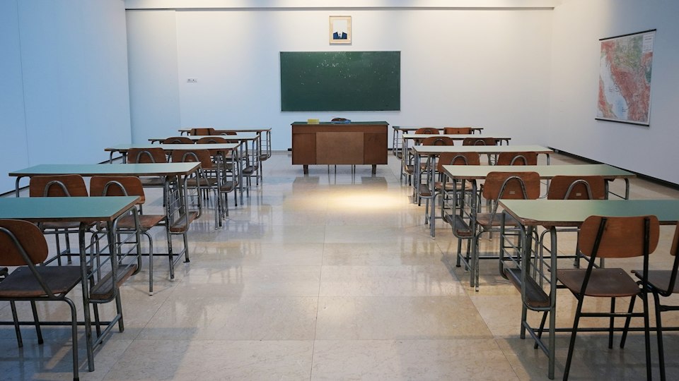 Illustration: a school classroom. Stock photograph by Ivan Aleksic / Unsplash, not a photograph of the school described in the article.