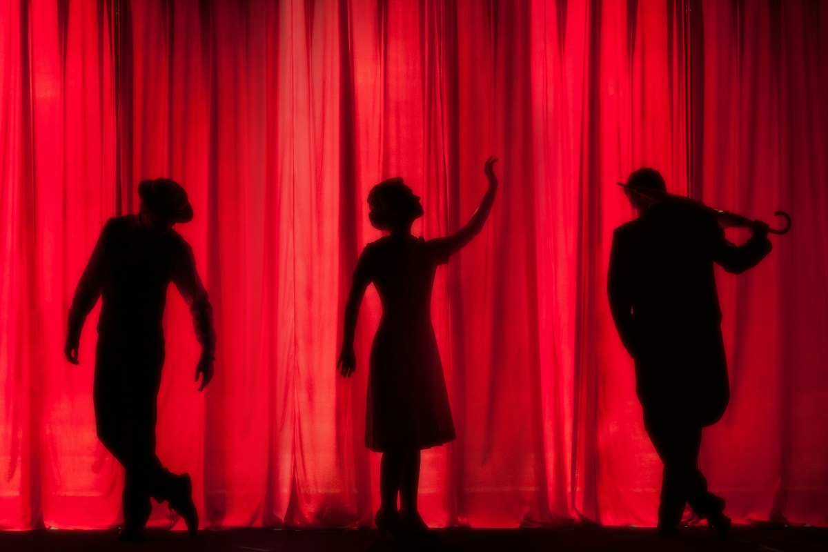 Illustration: performers on a theater stage, not a photograph of the announced Netanya show. Photo Kyle Head / Unsplash.
